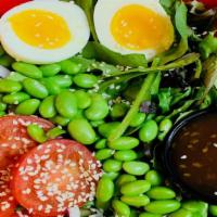 Asian Salad With Sesame Oriental Dressing · Mixed greens, tomato, onions, sesame seeds, egg, edamame, soybeans and Asian dressing on the...