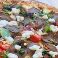 The Gyro Pizza · Lamb, beef, onions, tomato, spring mix, feta cheese, tzatziki sauce, olive oil.
