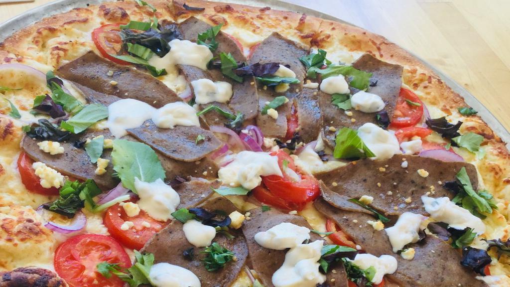 The Gyro Pizza · Lamb, beef, onions, tomato, spring mix, feta cheese, tzatziki sauce, olive oil.