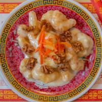 Honey Walnut Prawns · Breaded prawns covered in our house-made creamy sauce and topped with walnuts, carrots and p...