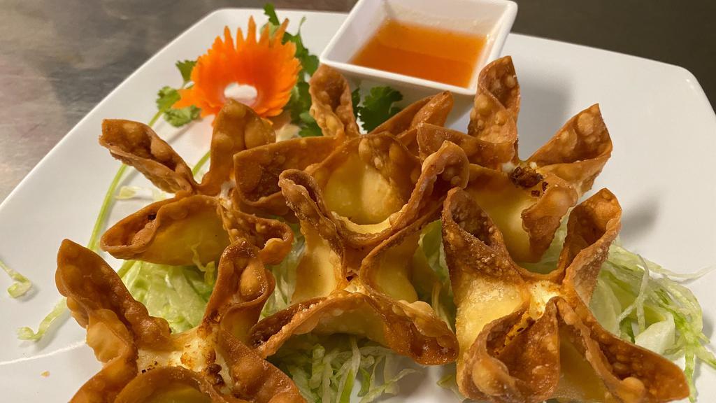 Crab Puff (6) · wonton filled with cream cheese, imitation crab neat served with sweet and sour sauce.