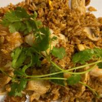 Tom Yum Fried Rice · Jasmine fried rice seasoned with a spicy tom yum paste, egg, shrimp, chicken, cabbage, mushr...