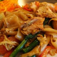 Drunken Noodle · Stir fried flat noodle with egg, napa cabbage, tomatoes, onions, bell pepper, green beans, c...