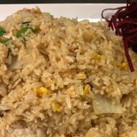 Thai Fried Rice · Traditional thai fried rice with egg, tomatoes, onions, and scallion. Add vegetable, tofu, p...