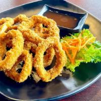 Calamari Rings · Large rings of squid, lightly breaded, deep fried and served with sweet and spicy dipping sa...