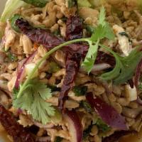 Larb | Chicken Salad (Gf) · Minced chicken cooked with onions, cilantro, toasted ground rice, lime juice dressing and to...