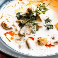 Tom Kah · Coconut milk soup mixed with chili paste and cooked with lemongrass, onions, mushrooms and t...