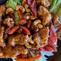 Crispy Cashew Chicken · Chicken breast pieces breaded and deep fried, tossed with chili paste, toasted cashews, and ...