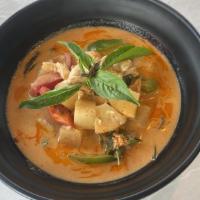Pineapple Curry (Gf) · Our red curry and coconut milk with basil, bell peppers and pineapples.