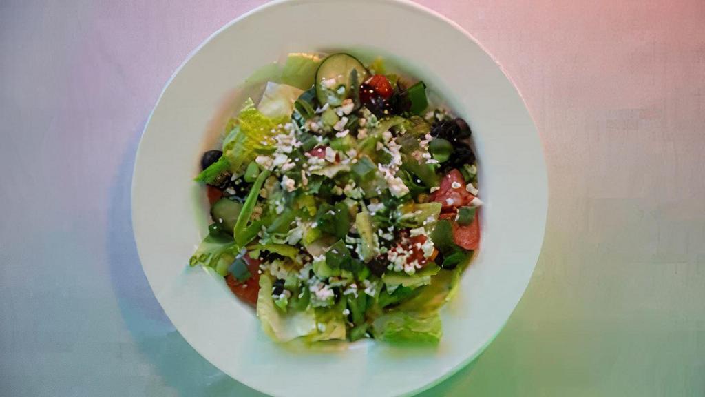 Greek Salad · Romaine lettuce, cucumber, tomatoes, black olives, green onions, and Feta cheese.