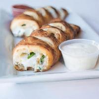 Veggie Stromboli · Our pizza dough wrapped around loads of cheese, Spinach, feta cheese, kalamata olives. Serve...