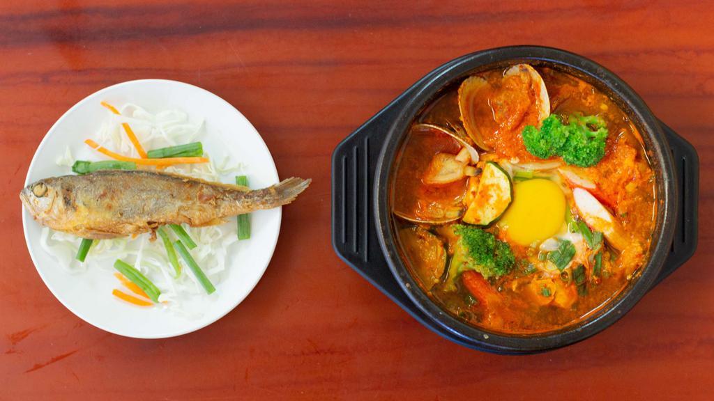 Seafood Soon Tofu Stew / 해물 순두부 · Shrimp, squid, clam and veggies. Served spicy. Comes with rice and side dish. Please contact the merchant for side dish selection.