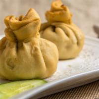 Vegetables Samosas · Two deep fried pastries with mildly spiced potatoes and peas.