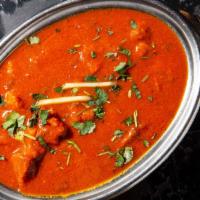 Lamb Vindaloo · A spicy specialty from Goa. Lamb cooked with vinegar spices and potatoes.