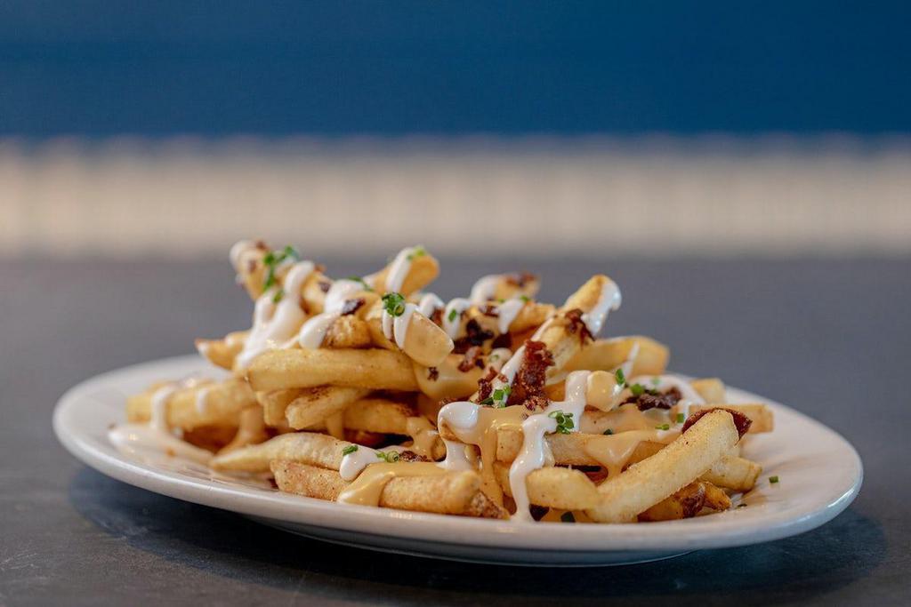 Loaded Fries · Applewood Smoked Bacon, Cheese Sauce, Sour Cream & Chives