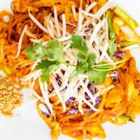 Pad Thai · Traditional Thai stir-fried rice noodles topped with crushed peanuts, carrots, purple cabbag...