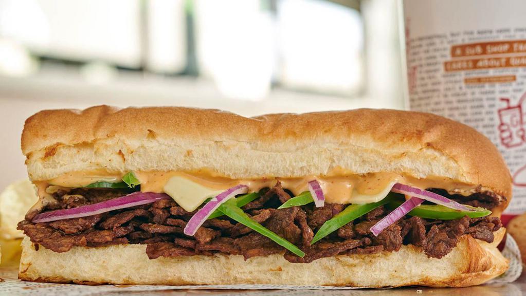 Chipotle Cheesesteak · Grilled steak, pepper jack cheese, green peppers, onions, Chipotle Ranch dressing