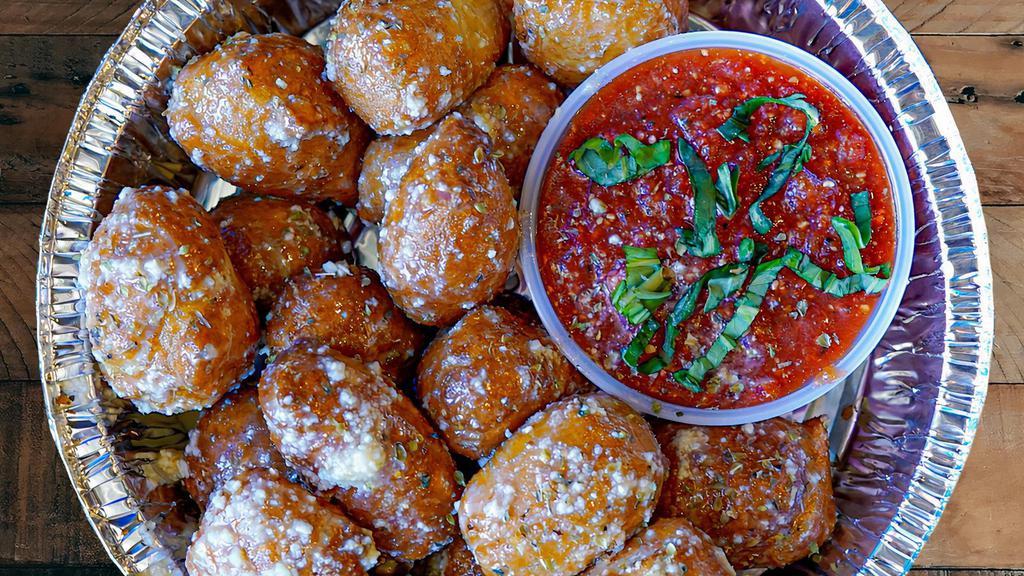 Garlic Parm Knots · Golden fried dough knots tossed in garlic butter & parmesan and. served with a side of red sauce