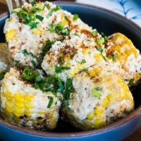 Grilled Mexican Street Corn · mayo, cilantro, lime, cotija cheese.