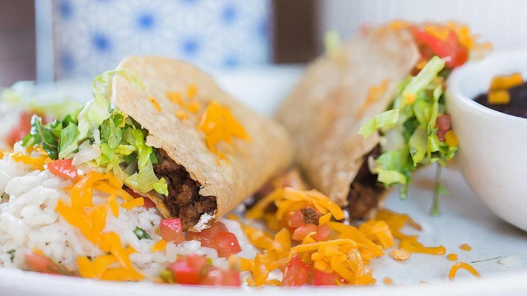 Crispy Shell Ground Beef Tacos · shredded lettuce, tomato, sour cream, yellow cheese.