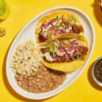 Slow Cooked Bbq Pork Tacos · roasted corn slaw, pickled onion, crema fresca