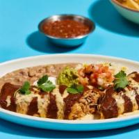 Braised Chicken Burrito  · charred onion, cilantro, jack cheese, red chile, warm queso sauce