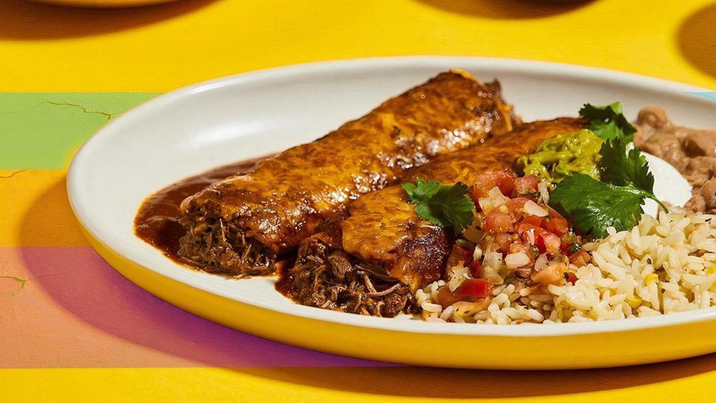Short Rib Machaca Enchiladas · caramelized peppers & onions, yellow cheese, ancho chile sauce, cilantro