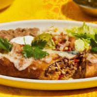Braised Chicken Chimichanga · cheese, guacamole, sour cream, pico de gallo, rice & beans. Make it enchilada style +$2