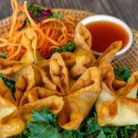 Crab Rangoon · Light and crispy wonton skin stuffed with crab meat and cream cheese served with sweet chili...