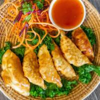 Pot Sticker · Ground chicken and vegetables served with sesame soy sauce.
