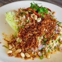 Thai Crispy Rice Salad · Ground pork with ginger, red onion, green onion and chili topped with Thai crispy rice.
