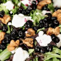 Huckleberry Salad · Fresh greens, goat cheese, huckleberries & candied walnuts, served with orange balsamic vina...