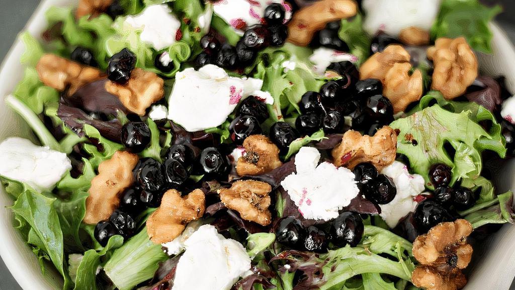 Huckleberry Salad · Fresh greens, goat cheese, huckleberries & candied walnuts, served with orange balsamic vinaigrette. (cal 480)