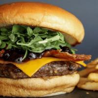 Big Sky Bison Burger · Hand-pressed bison burger, cheddar cheese, hickory-smoked bacon, huckleberry-jalapeño BBQ sa...