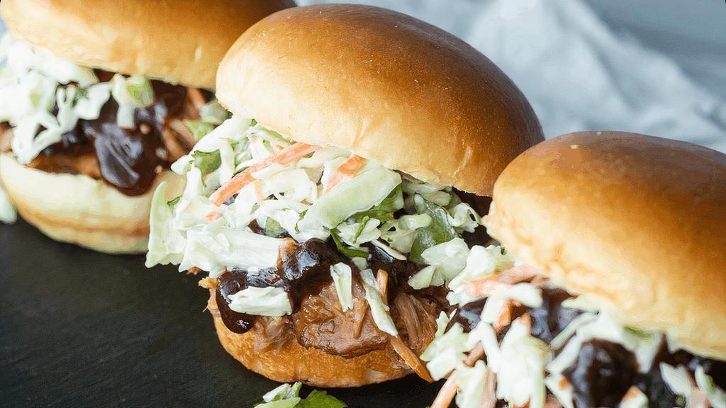 Pulled Pork Sliders · Smoked pulled pork with jalapeño-huckleberry BBQ sauce & house coleslaw on mini brioche buns. (cal 1030)