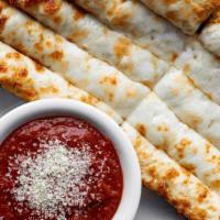 Lodgepoles · Fresh-baked bread with olive oil, garlic & mozzarella. Served with marinara.