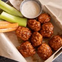 Boneless Wings · Breaded and tossed in your choice of spicy Buffalo, honey BBQ or Thai peanut. Served with ce...