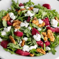 Beet Salad · Braised red beets, arugula, goat cheese & candied walnuts. Served with orange balsamic vinai...