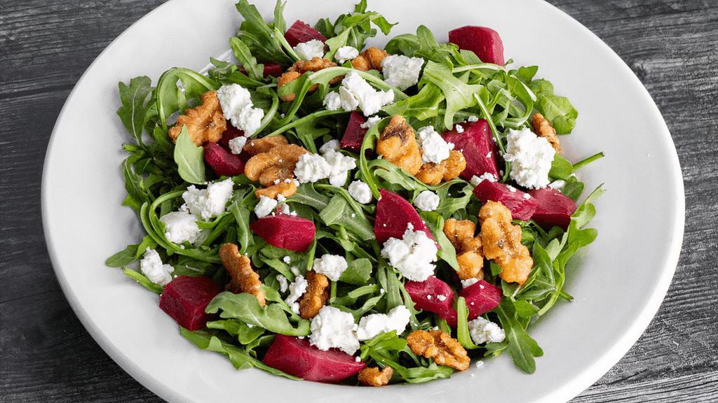 Beet Salad · Braised red beets, arugula, goat cheese & candied walnuts. Served with orange balsamic vinaigrette. (cal 590)