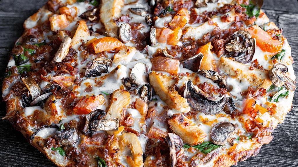 Flathead · Alfredo sauce, fajita chicken, smoky bacon, spinach, tomatoes, mushrooms & mozzarella. (cal 220-430 / slice)
