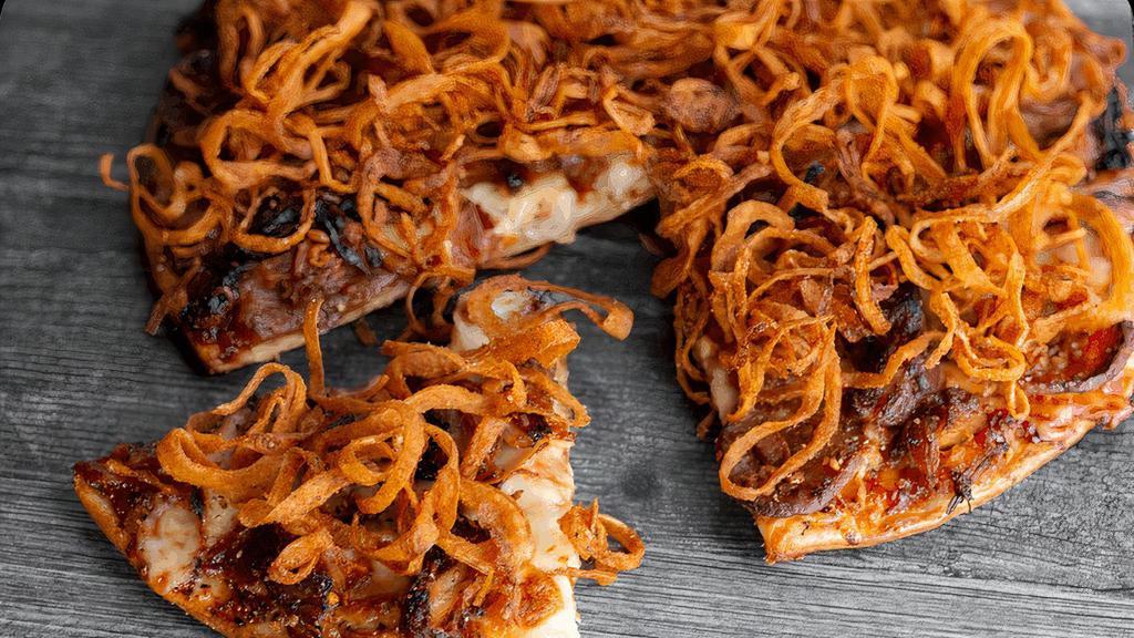 Smokin' Q · Smoky BBQ sauce, pulled pork, bacon, spicy sausage, smoked turkey & mozzarella, baked then topped with fried onion strings. (cal 230 - 450 / slice)