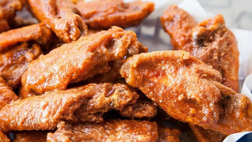Original Wings (13 Pcs.) · Recommended. Original or boneless chicken wings served with your choice of sauce, celery, carrots, and ranch dressing. All drums and paddles are available for an extra charge.