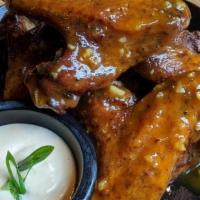 Smoked Chicken Wings · Smoked whole wings. Choice of Buffalo or Mango-Habanero sauce, ranch or blue cheese dressing...