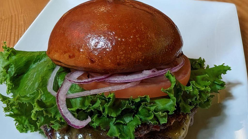 Pub Burger · Two quarter-pound Oregon Valley Natural grass-fed beef patties, cheddar, lettuce, tomato, red onion, beer-brined pickles, fry sauce, housemade bun