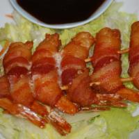 Prawns In The Blanket · Prawns wrapped with bacon then deep-fried and served with plum sauce.