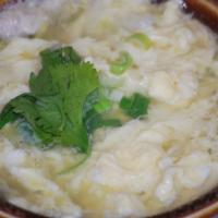 Egg Drop Soup · Clear chicken broth and cabbage finished with drop eggs and onions.