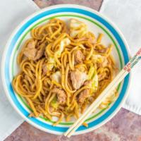 Hokkien Mee · Udon noodles are stir-fried with your choice of protein and chopped cabbage in Malaysian thi...