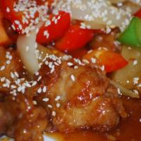 Sesame Orange Chicken · Crispy breaded chicken stir fried with onions, pineapple chunks and bell peppers in chef's u...