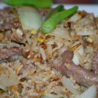 Garlic Fried Rice · Your choice of protein stir-fried with rice, eggs, and slices of garlic, onions, and green p...