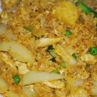 Pineapple Fried Rice · Jasmine rice stir-fried with your choice of protein, pineapple chunks, onions, green peas, e...